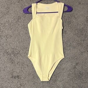 Chic Cream Ribbed Bodysuit